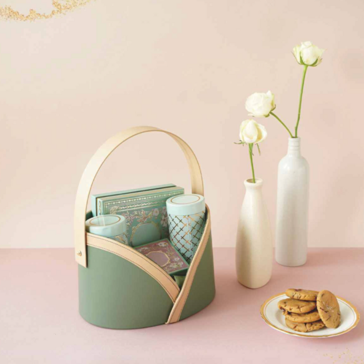 Elegant wedding return gifts displayed in a decorative basket.