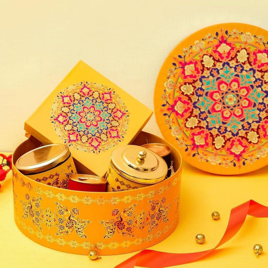 Traditional Indian wedding return gifts in vibrant colors.