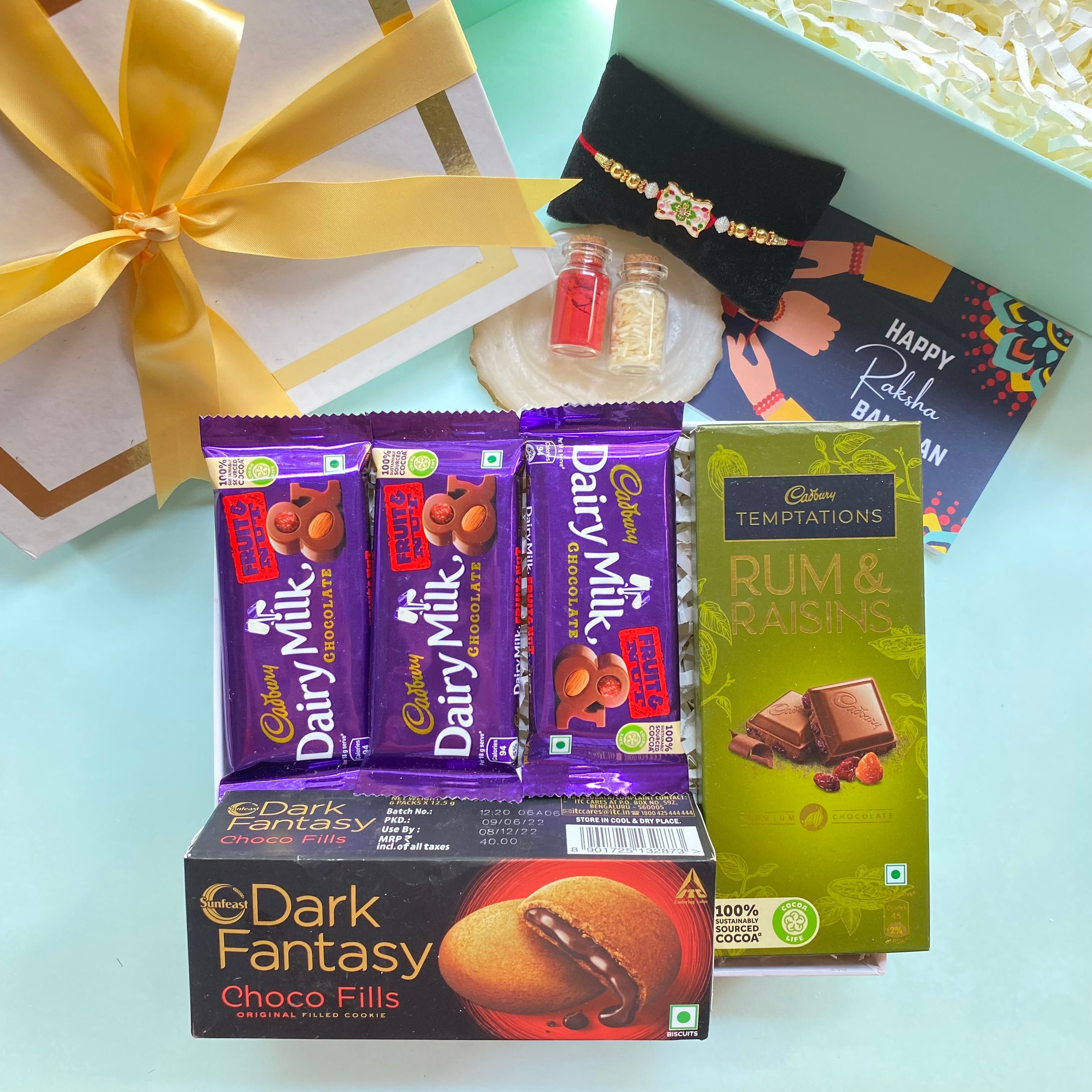 Send pretty stone rakhi pair with cadbury chocolates in bamboo box to  Chennai, Free Delivery - ChennaiOnlineFlorists